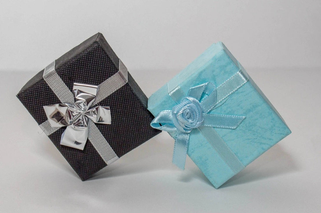 Elegant gift box with a blue bow on a dark background - perfect for gifting